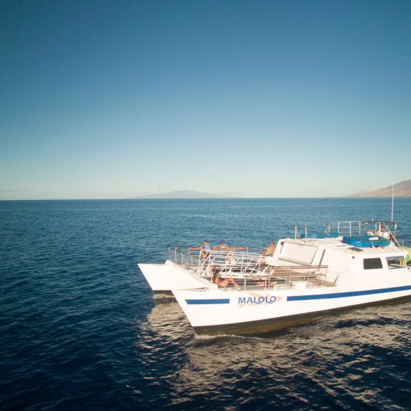 a small boat in a large body of water