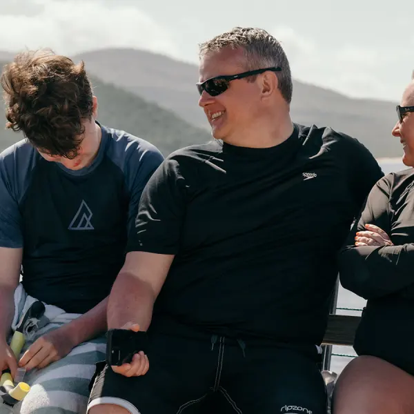 a couple of people that are sitting on a bench