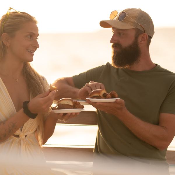 a man and a woman looking at a cell phone