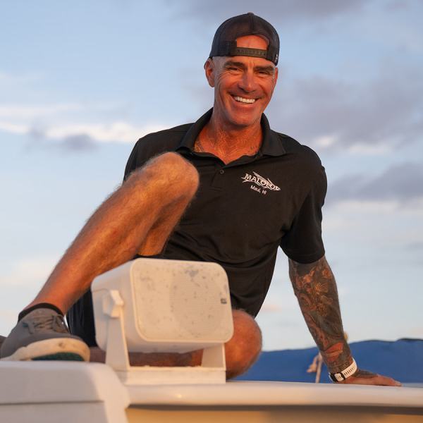 a man standing in front of water